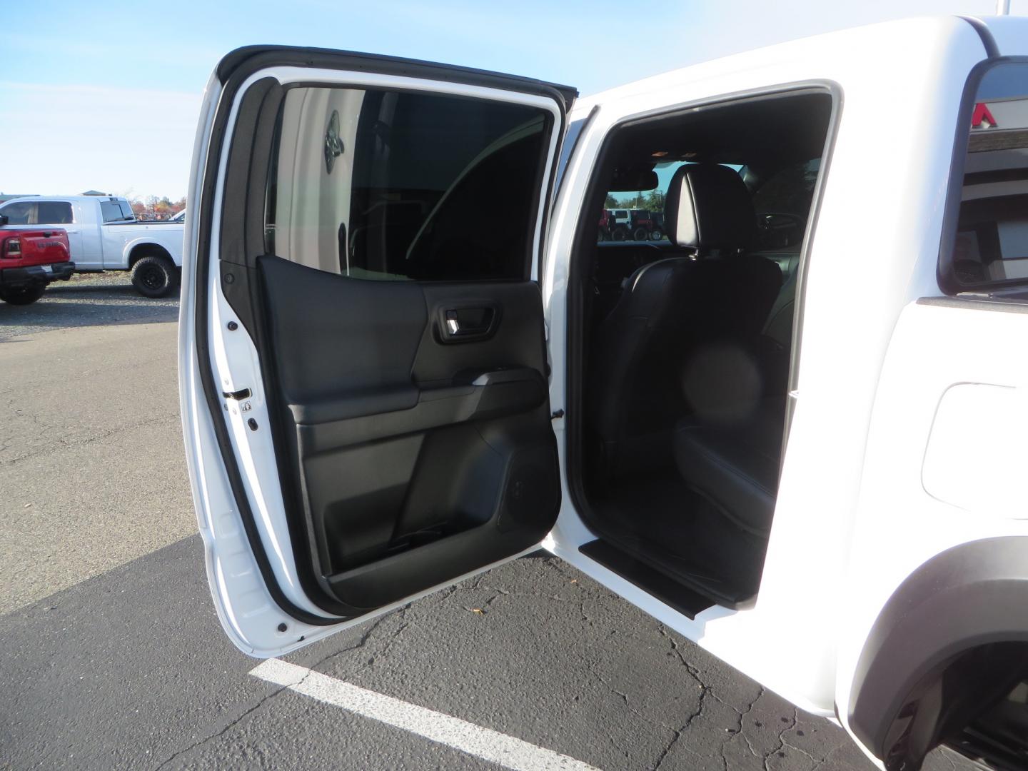 2019 White /black Toyota Tacoma TRD OFF-ROAD Double Cab (3TMAZ5CN4KM) with an 3.5L engine, automatic transmission, located at 2630 Grass Valley Highway, Auburn, CA, 95603, (530) 508-5100, 38.937893, -121.095482 - TRD Offroad 2WD sitting on Fox 2.5 remote reservoir DSC Coil-overs, Total Chaos upper control arms, Rigid Industries Dually side shooter leds, Fuel Rebel wheels, Nitto Ridge Grappler tires, and window tint. - Photo#34